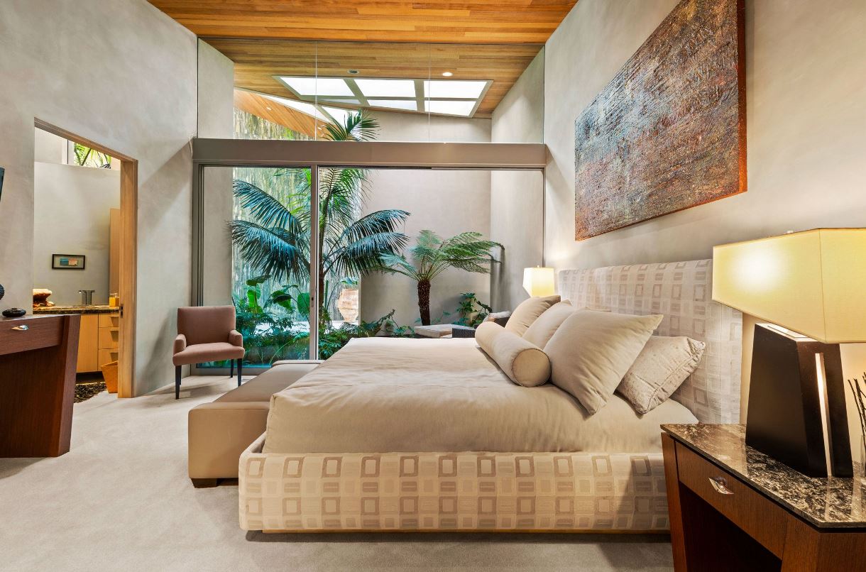 Consider incorporating dark bedroom ideas into your carpet design since they are currently popular. Dark carpets can help a huge bedroom feel more cozy, and choosing a hue with warm undertones can underline how cozy the room feels.