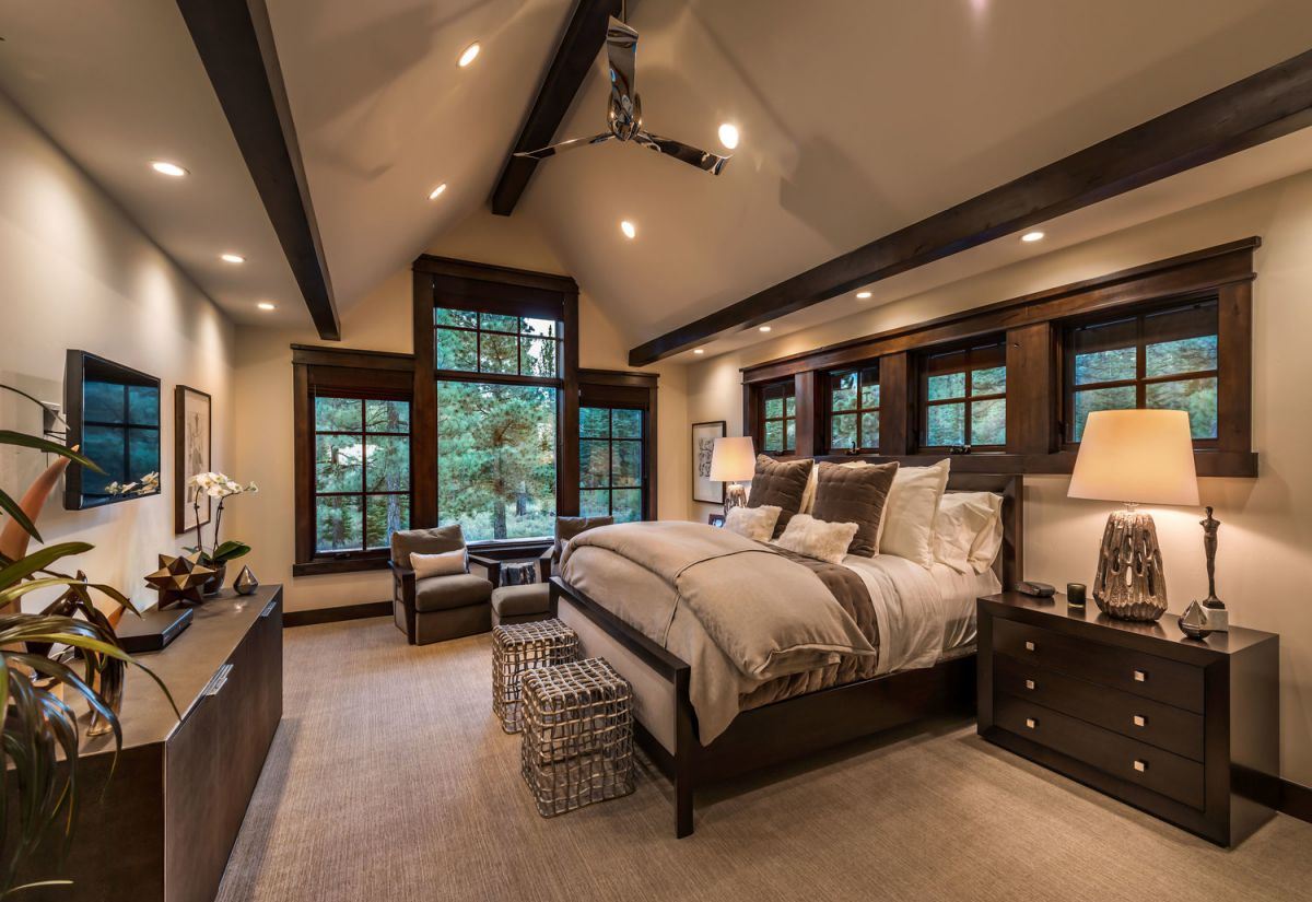 Another bright bedroom, like this one, is given a bold exclamation point by the presence of dark walls. To further connect your various design pieces, try mixing floral bedspreads together. Accents in light blue and yellow also maintain consistency in this area.
