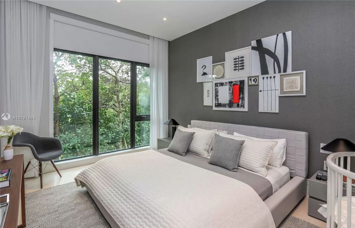Gold might not be the first hue that springs to mind when considering gloomy bedroom ideas, but as this room demonstrates, metallic furniture can provide even more drama than a grey wall. This little bedroom's walls and ceiling are painted in vintage grey, which bounces a warm, gloomy light around and creates a wonderful eclectic aesthetic that blurs the room's boundaries.