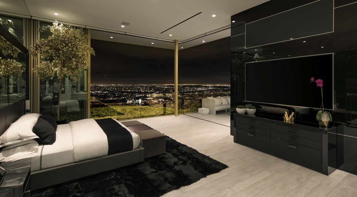 This gloomy retreat demonstrates why black bedrooms are becoming in popularity. Dark wall colors give the room a sense of richness, while natural textures and other natural features create a gentle, inviting atmosphere that lulls you to sleep. 