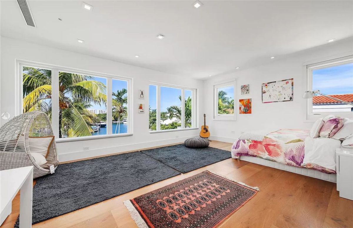 This master bedroom is made comfortable with conventional medallions and a striking border in pink and orange hues that evoke sunsets. These heavy traffic, stain-resistant runners are ideal for the location of the rugs here, which are placed on either side of the bed. A pleasant, soft surface to wake up on is created by runners on either side of the bed, which also protects your flooring and keeps the cost of your purchase low.