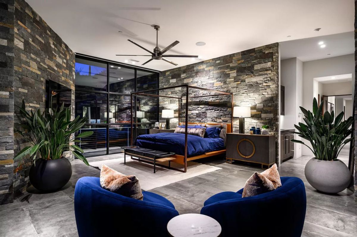 It is without a doubt appropriate to utilize blue in a gloomy bedroom because it is the hue of serenity. Consider delicate velvet bedding, as seen in this room, to add depth to an all-blue aesthetic. A serene yet opulent sleeping environment is created by the delicate furnishings and rich navy blue accents. It is classy without being formal.