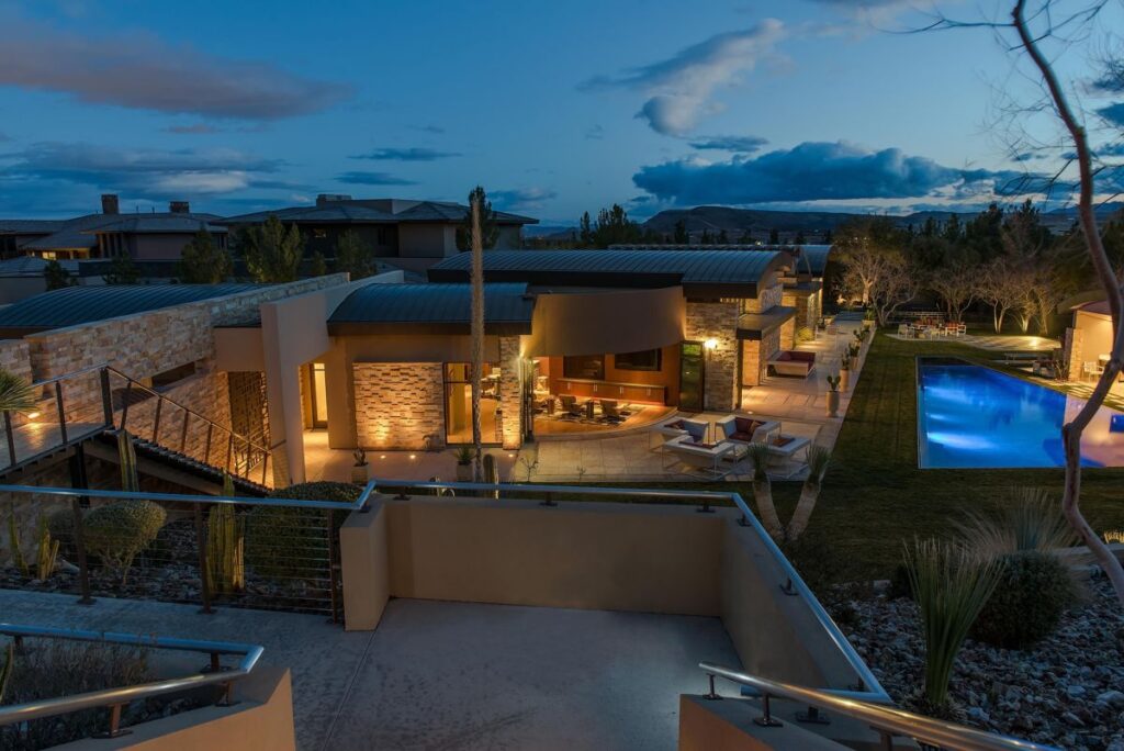 The Las Vegas Home for Sale is a luxuriously expansive and private estate in Summerlin now available for sale. This home located at 99 Hawk Ridge Dr, Las Vegas, Nevada; offering 8 bedrooms and 10 bathrooms with over 13,400 square feet of living spaces