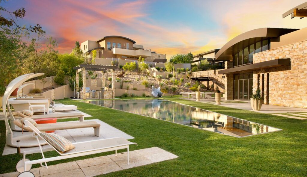 The Las Vegas Home for Sale is a luxuriously expansive and private estate in Summerlin now available for sale. This home located at 99 Hawk Ridge Dr, Las Vegas, Nevada; offering 8 bedrooms and 10 bathrooms with over 13,400 square feet of living spaces