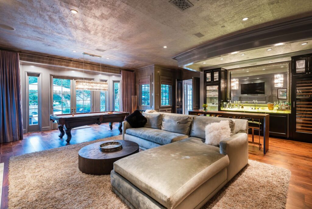 The Hamptons Style House is a Epic custom landmark estate with complete privacy and unobstructed fairway, lakes and mountain views now available for sale. This home located at 224 W Stafford Rd, Thousand Oaks, California; offering 5 bedrooms and 8 bathrooms with over 10,700 square feet of living spaces.