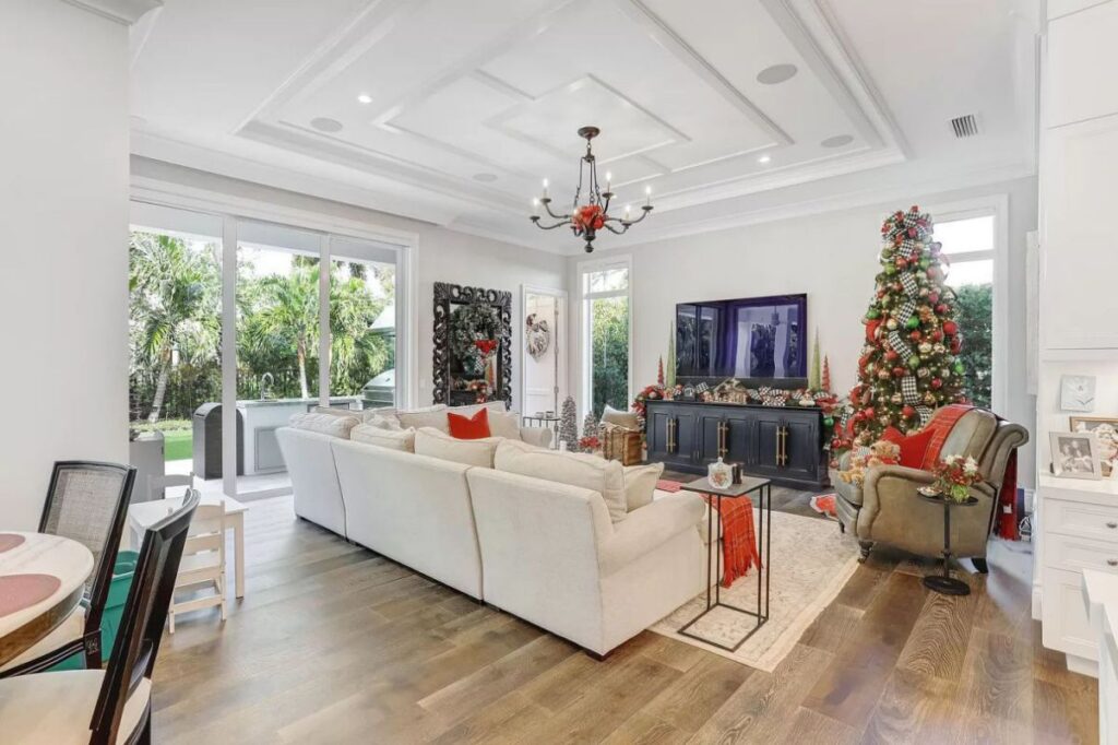 The Home for Sale in Boca Raton is a luxurious home with with specimen palms, is prelude to an up-lit mature tropical landscape, hedged and gated for privacy. This home located at 1717 Sabal Palm Dr, Boca Raton, Florida; offering 5 bedrooms and 9 bathrooms with over 6,800 square feet of living spaces.