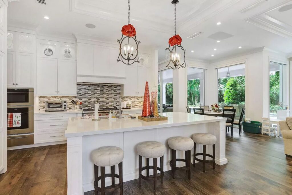 The Home for Sale in Boca Raton is a luxurious home with with specimen palms, is prelude to an up-lit mature tropical landscape, hedged and gated for privacy. This home located at 1717 Sabal Palm Dr, Boca Raton, Florida; offering 5 bedrooms and 9 bathrooms with over 6,800 square feet of living spaces.