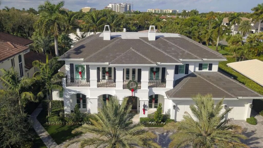 The Home for Sale in Boca Raton is a luxurious home with with specimen palms, is prelude to an up-lit mature tropical landscape, hedged and gated for privacy. This home located at 1717 Sabal Palm Dr, Boca Raton, Florida; offering 5 bedrooms and 9 bathrooms with over 6,800 square feet of living spaces.