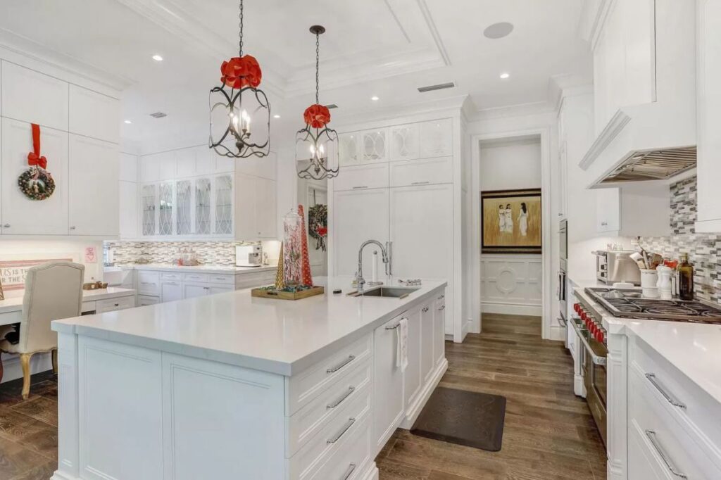 The Home for Sale in Boca Raton is a luxurious home with with specimen palms, is prelude to an up-lit mature tropical landscape, hedged and gated for privacy. This home located at 1717 Sabal Palm Dr, Boca Raton, Florida; offering 5 bedrooms and 9 bathrooms with over 6,800 square feet of living spaces.