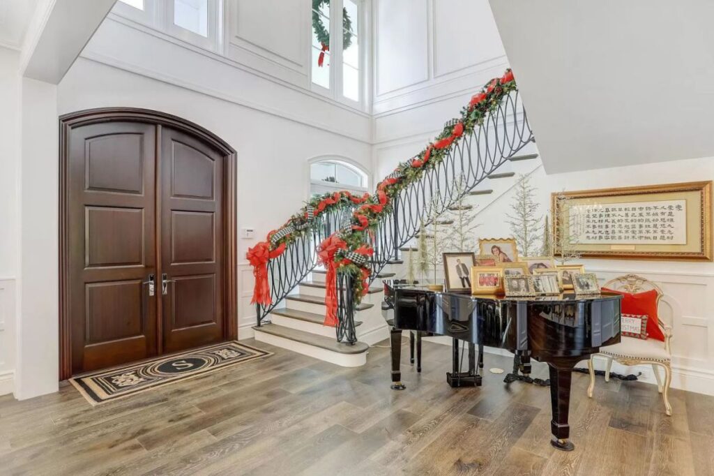 The Home for Sale in Boca Raton is a luxurious home with with specimen palms, is prelude to an up-lit mature tropical landscape, hedged and gated for privacy. This home located at 1717 Sabal Palm Dr, Boca Raton, Florida; offering 5 bedrooms and 9 bathrooms with over 6,800 square feet of living spaces.