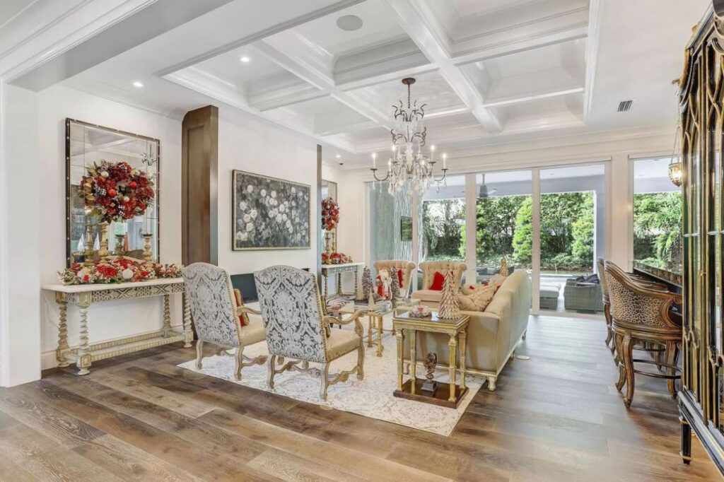 The Home for Sale in Boca Raton is a luxurious home with with specimen palms, is prelude to an up-lit mature tropical landscape, hedged and gated for privacy. This home located at 1717 Sabal Palm Dr, Boca Raton, Florida; offering 5 bedrooms and 9 bathrooms with over 6,800 square feet of living spaces.