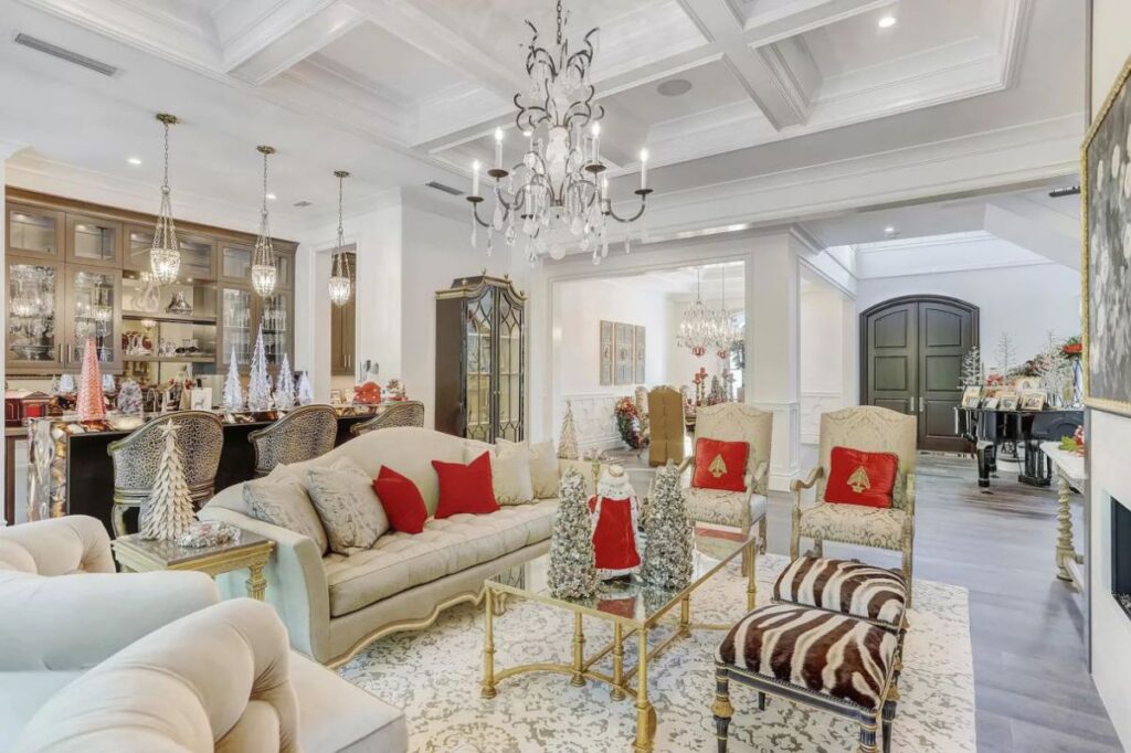 The Home for Sale in Boca Raton is a luxurious home with with specimen palms, is prelude to an up-lit mature tropical landscape, hedged and gated for privacy. This home located at 1717 Sabal Palm Dr, Boca Raton, Florida; offering 5 bedrooms and 9 bathrooms with over 6,800 square feet of living spaces.