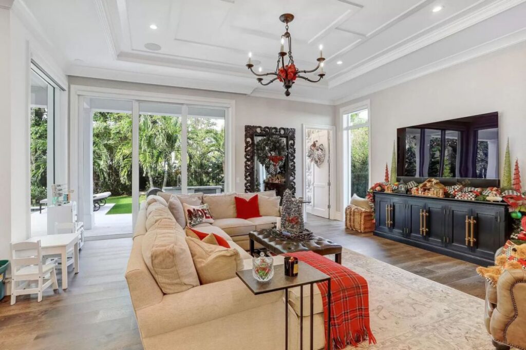 The Home for Sale in Boca Raton is a luxurious home with with specimen palms, is prelude to an up-lit mature tropical landscape, hedged and gated for privacy. This home located at 1717 Sabal Palm Dr, Boca Raton, Florida; offering 5 bedrooms and 9 bathrooms with over 6,800 square feet of living spaces.