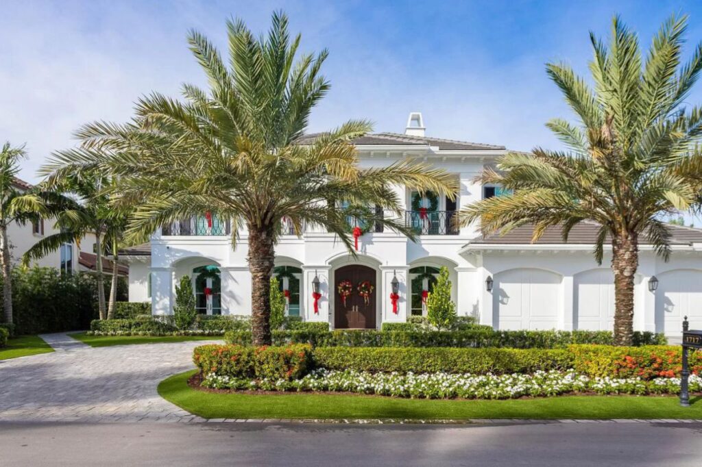 The Home for Sale in Boca Raton is a luxurious home with with specimen palms, is prelude to an up-lit mature tropical landscape, hedged and gated for privacy. This home located at 1717 Sabal Palm Dr, Boca Raton, Florida; offering 5 bedrooms and 9 bathrooms with over 6,800 square feet of living spaces.