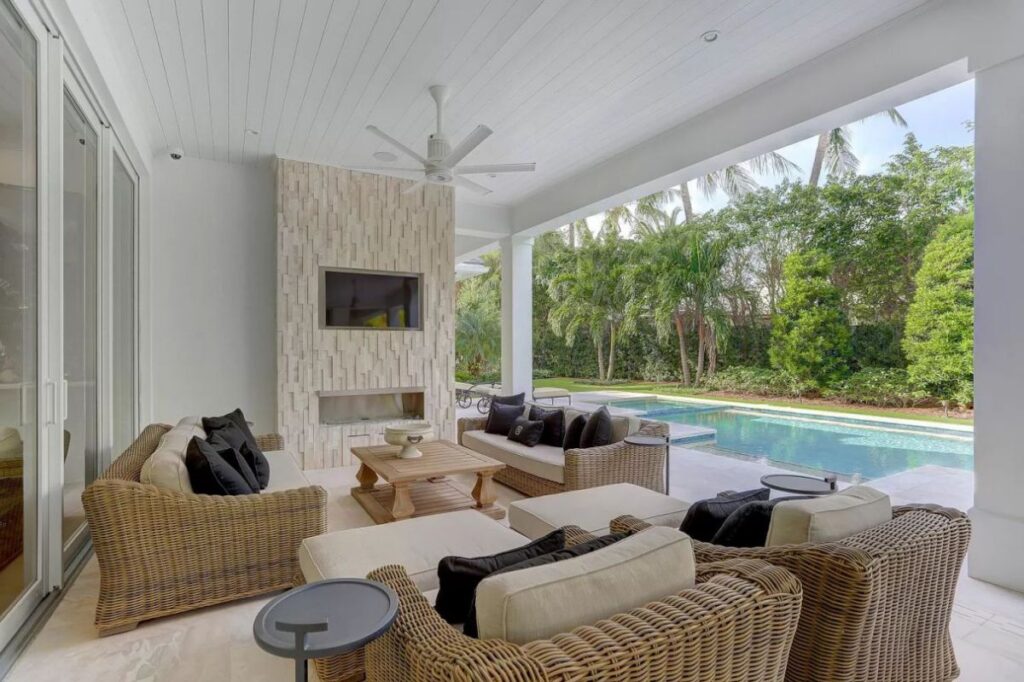 The Home for Sale in Boca Raton is a luxurious home with with specimen palms, is prelude to an up-lit mature tropical landscape, hedged and gated for privacy. This home located at 1717 Sabal Palm Dr, Boca Raton, Florida; offering 5 bedrooms and 9 bathrooms with over 6,800 square feet of living spaces.