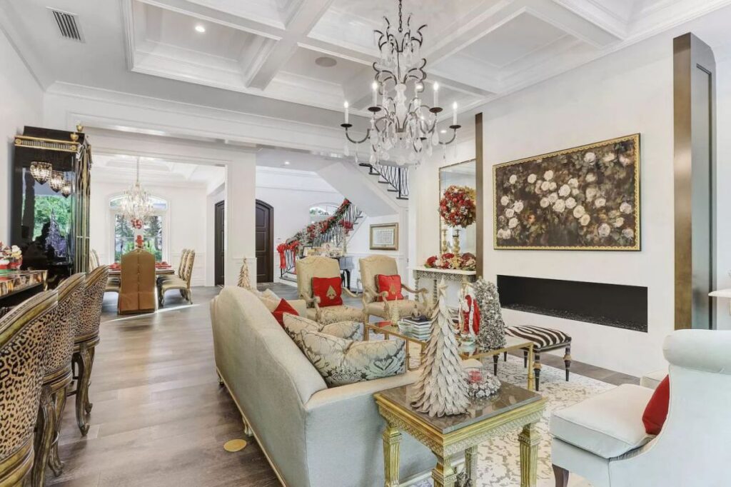 The Home for Sale in Boca Raton is a luxurious home with with specimen palms, is prelude to an up-lit mature tropical landscape, hedged and gated for privacy. This home located at 1717 Sabal Palm Dr, Boca Raton, Florida; offering 5 bedrooms and 9 bathrooms with over 6,800 square feet of living spaces.