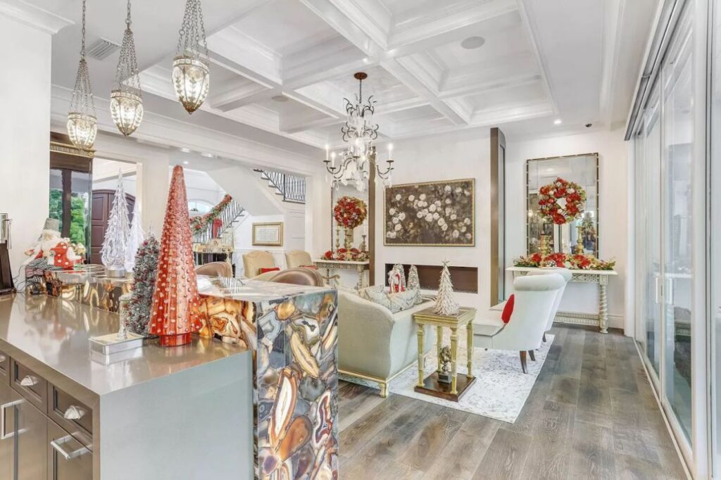 The Home for Sale in Boca Raton is a luxurious home with with specimen palms, is prelude to an up-lit mature tropical landscape, hedged and gated for privacy. This home located at 1717 Sabal Palm Dr, Boca Raton, Florida; offering 5 bedrooms and 9 bathrooms with over 6,800 square feet of living spaces.