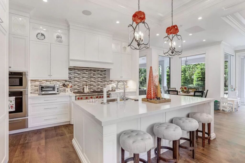 The Home for Sale in Boca Raton is a luxurious home with with specimen palms, is prelude to an up-lit mature tropical landscape, hedged and gated for privacy. This home located at 1717 Sabal Palm Dr, Boca Raton, Florida; offering 5 bedrooms and 9 bathrooms with over 6,800 square feet of living spaces.