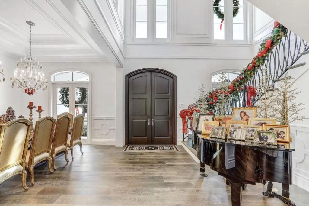 The Home for Sale in Boca Raton is a luxurious home with with specimen palms, is prelude to an up-lit mature tropical landscape, hedged and gated for privacy. This home located at 1717 Sabal Palm Dr, Boca Raton, Florida; offering 5 bedrooms and 9 bathrooms with over 6,800 square feet of living spaces.