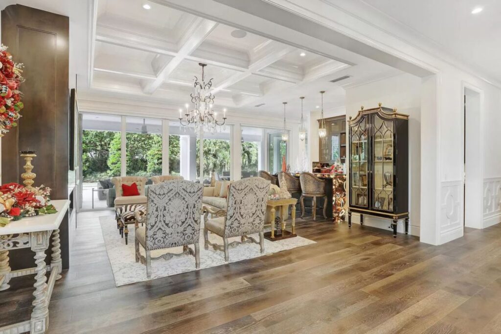 The Home for Sale in Boca Raton is a luxurious home with with specimen palms, is prelude to an up-lit mature tropical landscape, hedged and gated for privacy. This home located at 1717 Sabal Palm Dr, Boca Raton, Florida; offering 5 bedrooms and 9 bathrooms with over 6,800 square feet of living spaces.