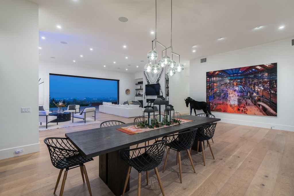 The Hidden Hills House is an absolutely extraordinary single story modern with explosive panoramic unobstructed city light views now available for sale. This home located at 5550 Bonneville Rd, Hidden Hills, California; offering 4 bedrooms and 5 bathrooms with over 4,800 square feet of living spaces.