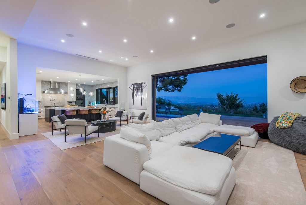 The Hidden Hills House is an absolutely extraordinary single story modern with explosive panoramic unobstructed city light views now available for sale. This home located at 5550 Bonneville Rd, Hidden Hills, California; offering 4 bedrooms and 5 bathrooms with over 4,800 square feet of living spaces.