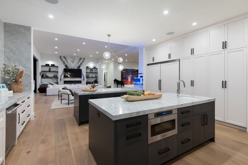 The Hidden Hills House is an absolutely extraordinary single story modern with explosive panoramic unobstructed city light views now available for sale. This home located at 5550 Bonneville Rd, Hidden Hills, California; offering 4 bedrooms and 5 bathrooms with over 4,800 square feet of living spaces.