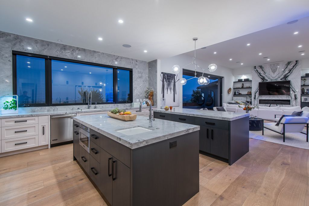 The Hidden Hills House is an absolutely extraordinary single story modern with explosive panoramic unobstructed city light views now available for sale. This home located at 5550 Bonneville Rd, Hidden Hills, California; offering 4 bedrooms and 5 bathrooms with over 4,800 square feet of living spaces.