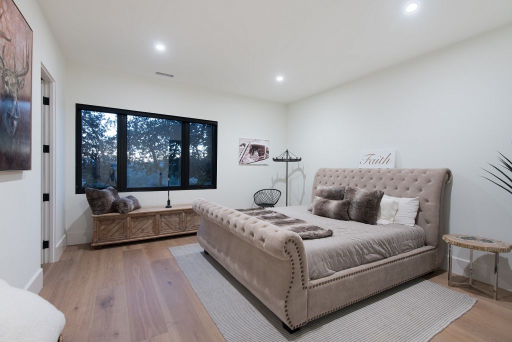 The Hidden Hills House is an absolutely extraordinary single story modern with explosive panoramic unobstructed city light views now available for sale. This home located at 5550 Bonneville Rd, Hidden Hills, California; offering 4 bedrooms and 5 bathrooms with over 4,800 square feet of living spaces.
