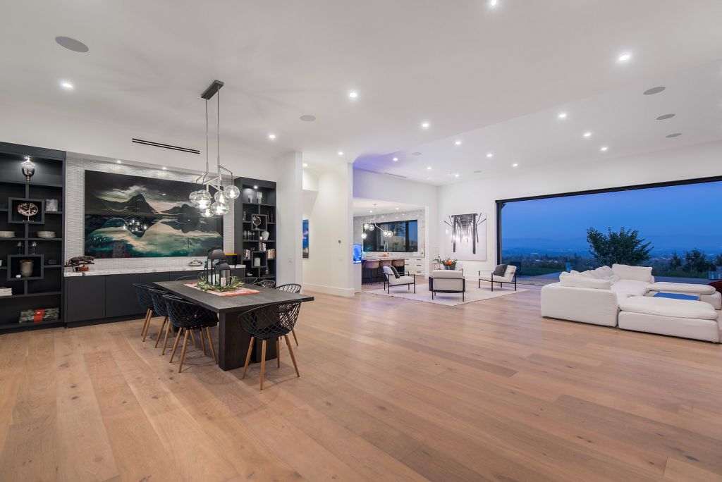 The Hidden Hills House is an absolutely extraordinary single story modern with explosive panoramic unobstructed city light views now available for sale. This home located at 5550 Bonneville Rd, Hidden Hills, California; offering 4 bedrooms and 5 bathrooms with over 4,800 square feet of living spaces.