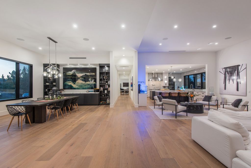 The Hidden Hills House is an absolutely extraordinary single story modern with explosive panoramic unobstructed city light views now available for sale. This home located at 5550 Bonneville Rd, Hidden Hills, California; offering 4 bedrooms and 5 bathrooms with over 4,800 square feet of living spaces.