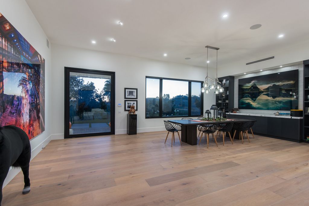 The Hidden Hills House is an absolutely extraordinary single story modern with explosive panoramic unobstructed city light views now available for sale. This home located at 5550 Bonneville Rd, Hidden Hills, California; offering 4 bedrooms and 5 bathrooms with over 4,800 square feet of living spaces.