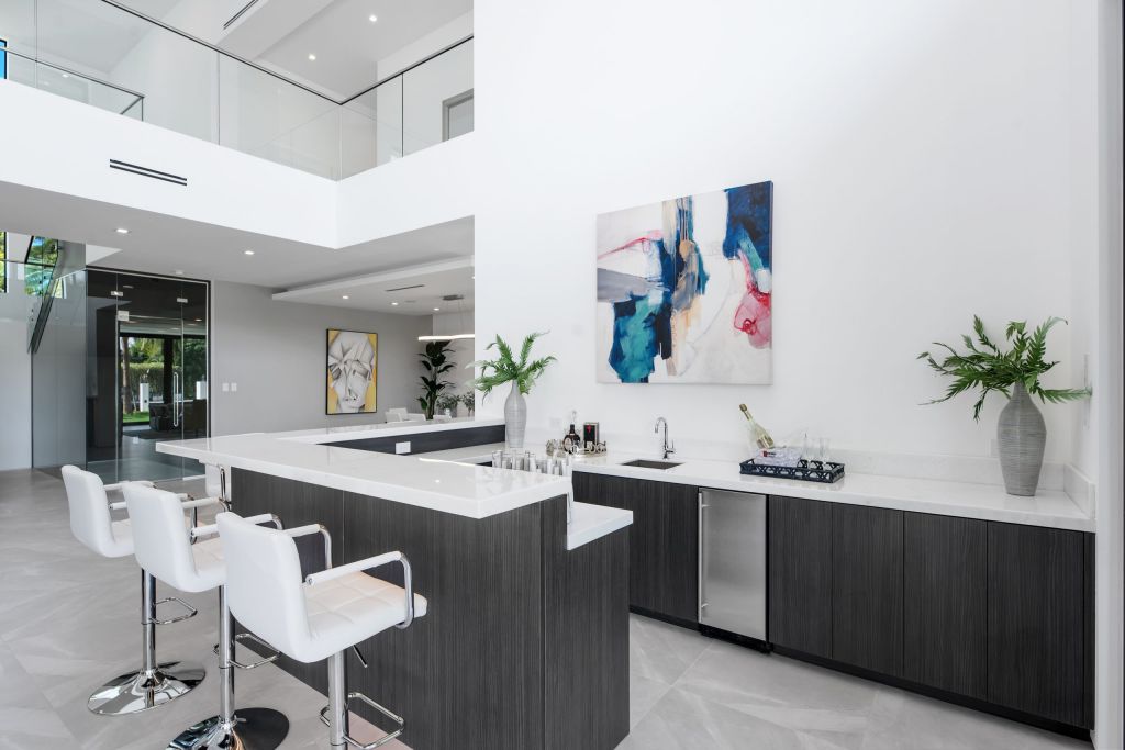 The Fort Lauderdale House is a luxurious property has amazing pool and waterfront views of stunning simplicity and sophistication now available for sale. This home located at 188 Nurmi Dr, Fort Lauderdale, Florida; offering 6 bedrooms and 7 bathrooms with over 7,500 square feet of living spaces.