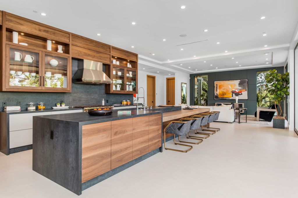 The House in Encino is a newly constructed contemporary masterpiece with unobstructed views in the coveted Royal Oaks now available for sale. This home located at 3950 Royal Oak Pl, Encino, California; offering 8 bedrooms and 14 bathrooms with over 13,000 square feet of living spaces
