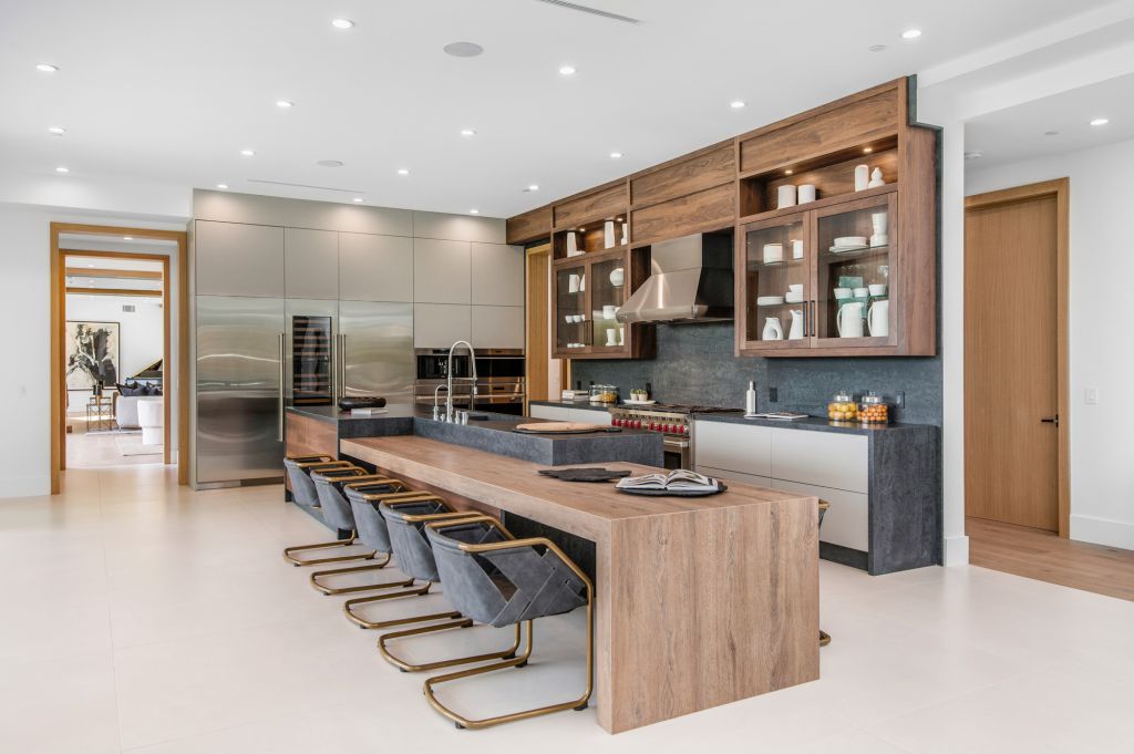 The House in Encino is a newly constructed contemporary masterpiece with unobstructed views in the coveted Royal Oaks now available for sale. This home located at 3950 Royal Oak Pl, Encino, California; offering 8 bedrooms and 14 bathrooms with over 13,000 square feet of living spaces