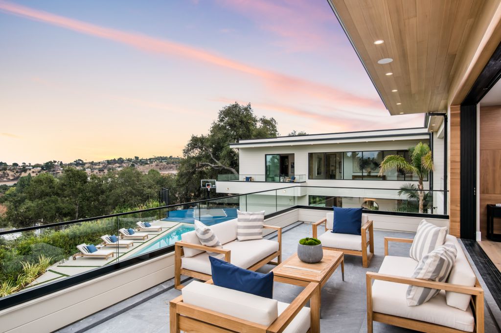 The House in Encino is a newly constructed contemporary masterpiece with unobstructed views in the coveted Royal Oaks now available for sale. This home located at 3950 Royal Oak Pl, Encino, California; offering 8 bedrooms and 14 bathrooms with over 13,000 square feet of living spaces