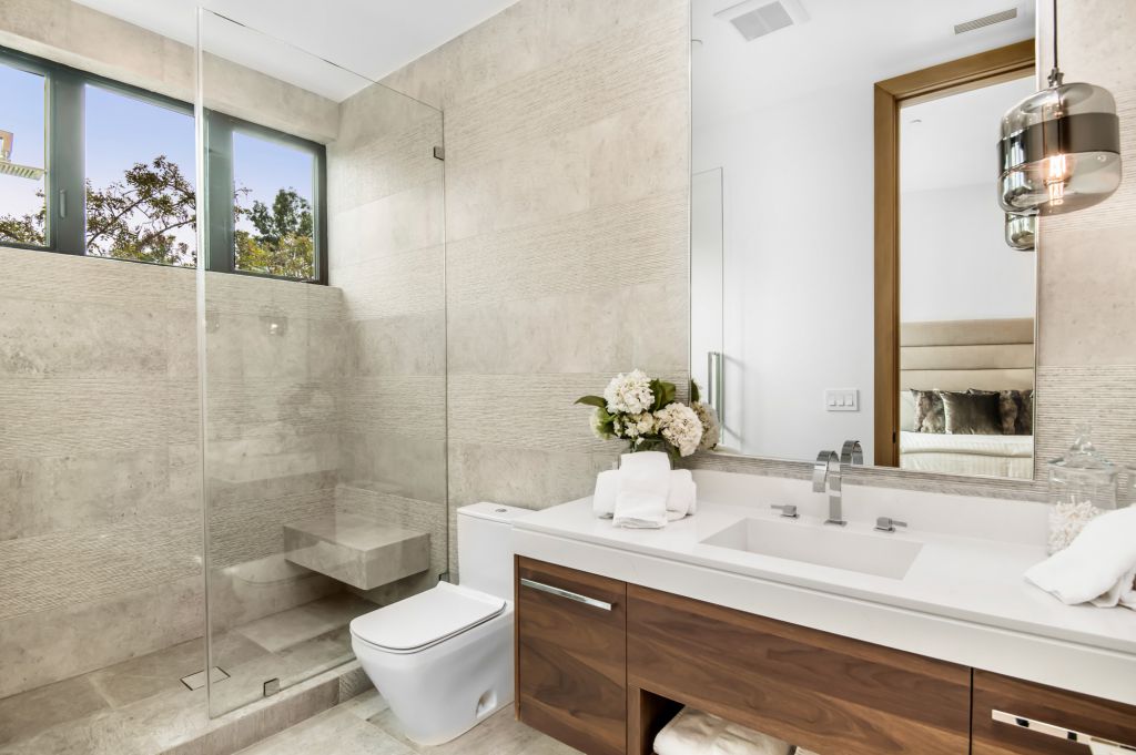 The House in Encino is a newly constructed contemporary masterpiece with unobstructed views in the coveted Royal Oaks now available for sale. This home located at 3950 Royal Oak Pl, Encino, California; offering 8 bedrooms and 14 bathrooms with over 13,000 square feet of living spaces