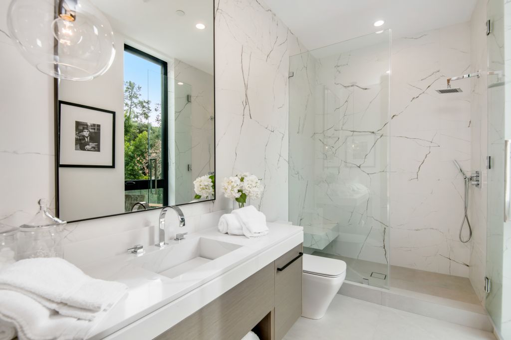 The House in Encino is a newly constructed contemporary masterpiece with unobstructed views in the coveted Royal Oaks now available for sale. This home located at 3950 Royal Oak Pl, Encino, California; offering 8 bedrooms and 14 bathrooms with over 13,000 square feet of living spaces