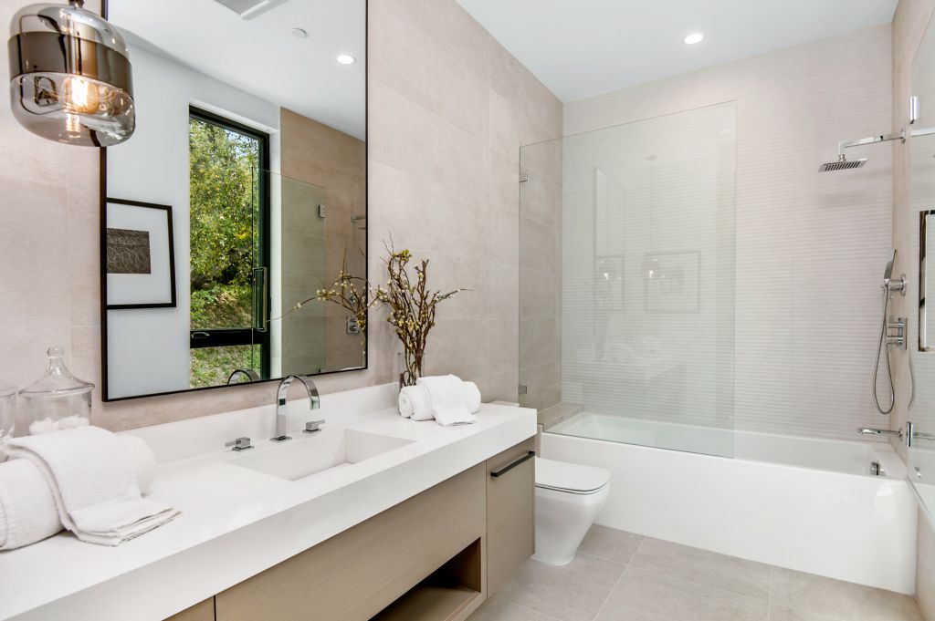 The House in Encino is a newly constructed contemporary masterpiece with unobstructed views in the coveted Royal Oaks now available for sale. This home located at 3950 Royal Oak Pl, Encino, California; offering 8 bedrooms and 14 bathrooms with over 13,000 square feet of living spaces