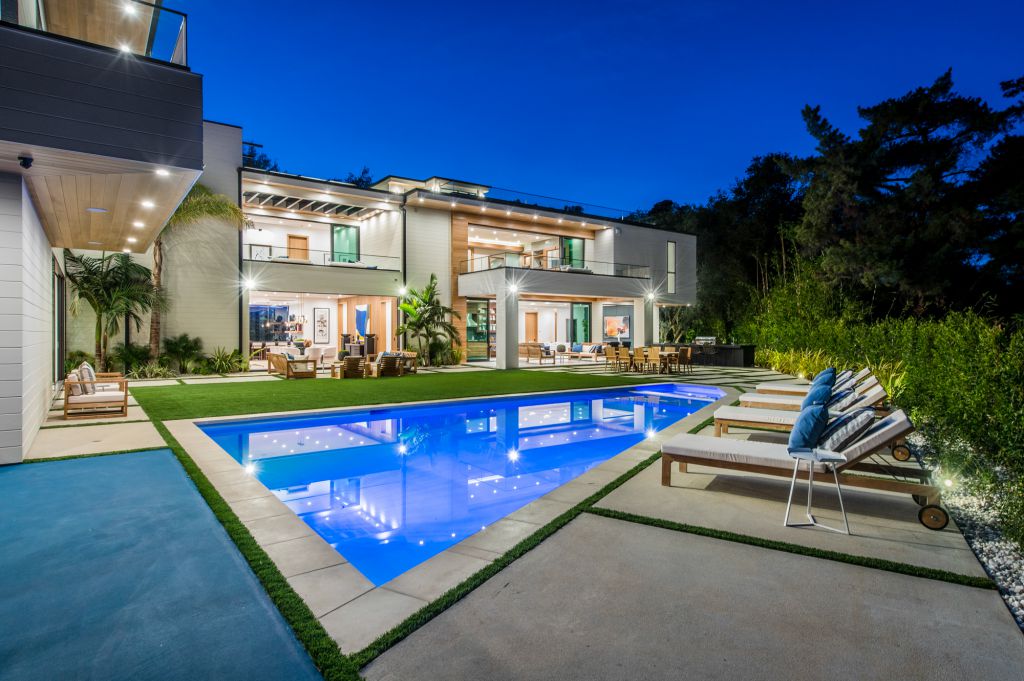 The House in Encino is a newly constructed contemporary masterpiece with unobstructed views in the coveted Royal Oaks now available for sale. This home located at 3950 Royal Oak Pl, Encino, California; offering 8 bedrooms and 14 bathrooms with over 13,000 square feet of living spaces