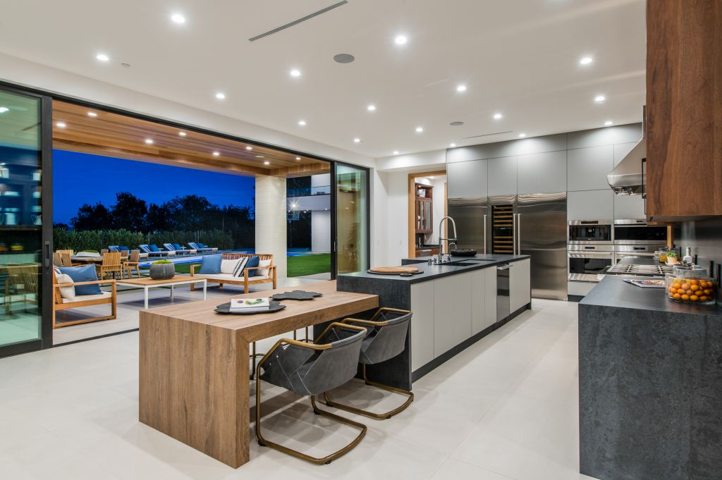 The House in Encino is a newly constructed contemporary masterpiece with unobstructed views in the coveted Royal Oaks now available for sale. This home located at 3950 Royal Oak Pl, Encino, California; offering 8 bedrooms and 14 bathrooms with over 13,000 square feet of living spaces
