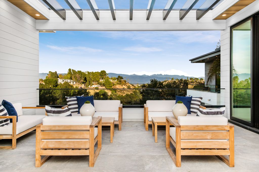 The House in Encino is a newly constructed contemporary masterpiece with unobstructed views in the coveted Royal Oaks now available for sale. This home located at 3950 Royal Oak Pl, Encino, California; offering 8 bedrooms and 14 bathrooms with over 13,000 square feet of living spaces