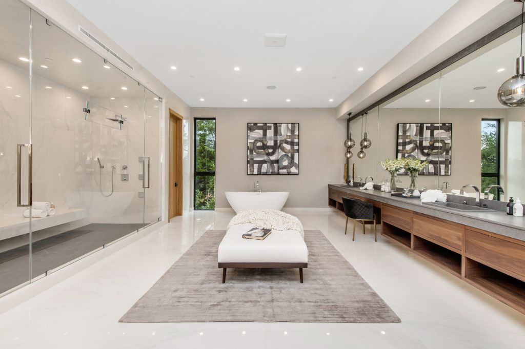 The House in Encino is a newly constructed contemporary masterpiece with unobstructed views in the coveted Royal Oaks now available for sale. This home located at 3950 Royal Oak Pl, Encino, California; offering 8 bedrooms and 14 bathrooms with over 13,000 square feet of living spaces