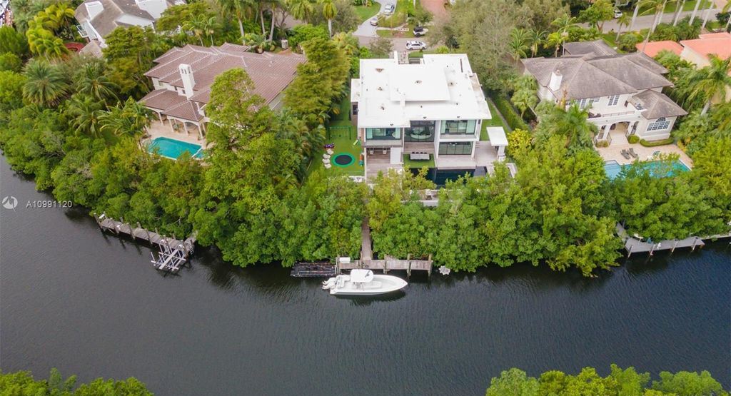 The Coral Gables House is a luxurious estate in gated amenity-rich Islands of Cocoplum now available for sale. This home located at 132 Paloma Dr, Coral Gables, Florida; offering 5 bedrooms and 6 bathrooms with over 6,300 square feet of living spaces.