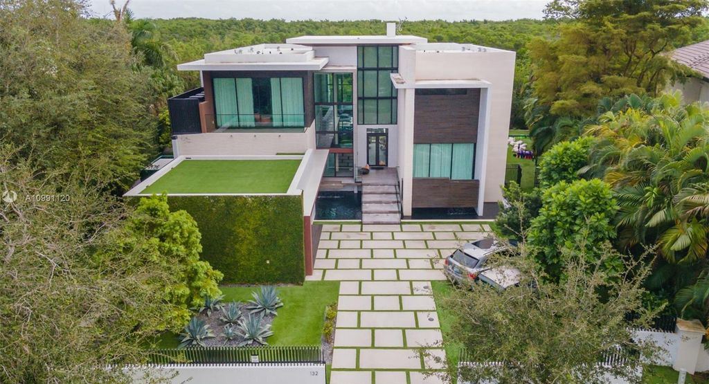 The Coral Gables House is a luxurious estate in gated amenity-rich Islands of Cocoplum now available for sale. This home located at 132 Paloma Dr, Coral Gables, Florida; offering 5 bedrooms and 6 bathrooms with over 6,300 square feet of living spaces.