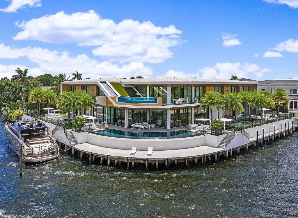 The Boca Raton Mansion is a spectacular contemporary residence on an oversized Intracoastal Waterway lot now available for sale. This home located at 819 Orchid Dr, Boca Raton, Florida; offering 9 bedrooms and 14 bathrooms with over 12,600 square feet of living spaces.