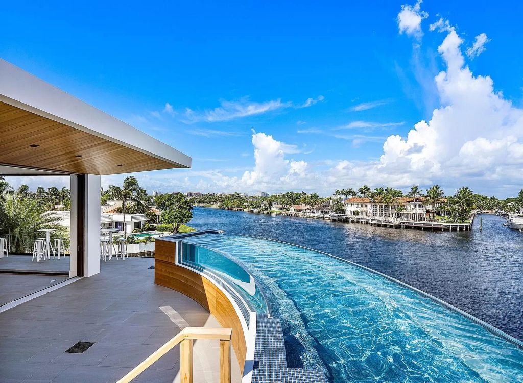 The Boca Raton Mansion is a spectacular contemporary residence on an oversized Intracoastal Waterway lot now available for sale. This home located at 819 Orchid Dr, Boca Raton, Florida; offering 9 bedrooms and 14 bathrooms with over 12,600 square feet of living spaces.