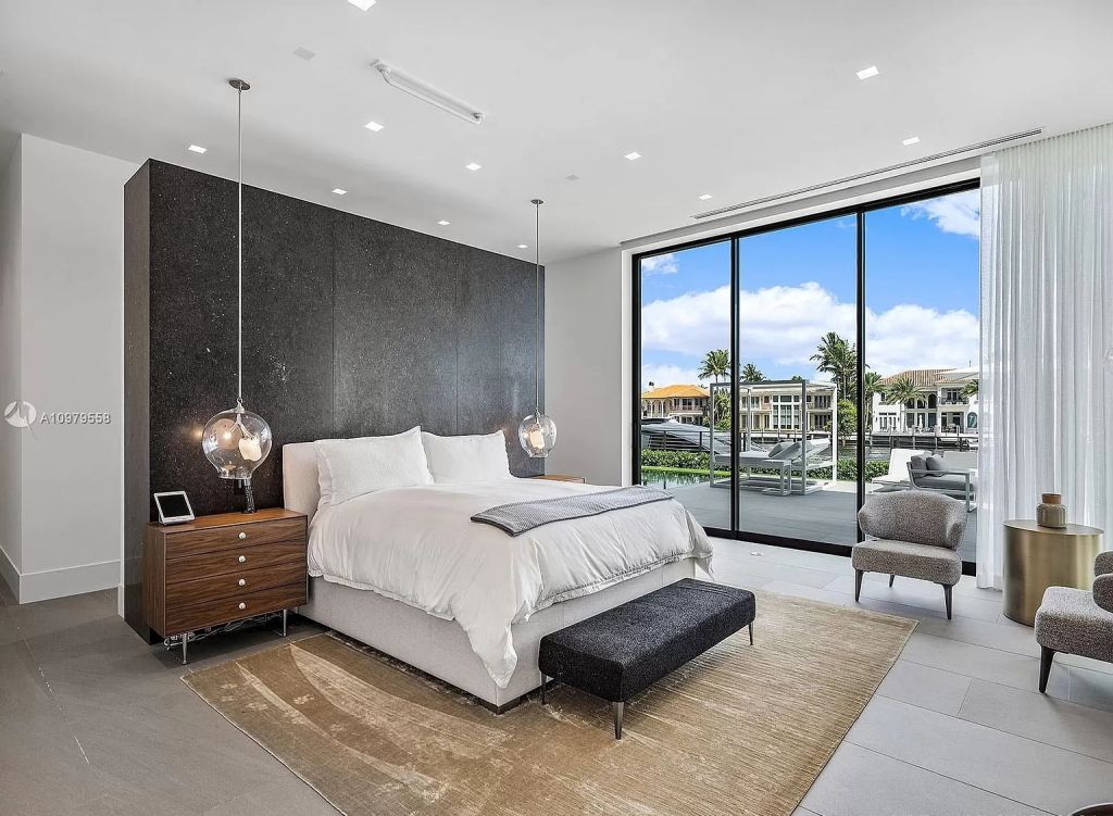 The Boca Raton Mansion is a spectacular contemporary residence on an oversized Intracoastal Waterway lot now available for sale. This home located at 819 Orchid Dr, Boca Raton, Florida; offering 9 bedrooms and 14 bathrooms with over 12,600 square feet of living spaces.