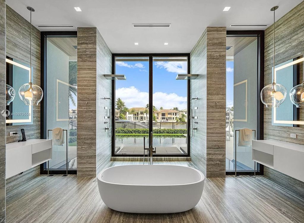 The Boca Raton Mansion is a spectacular contemporary residence on an oversized Intracoastal Waterway lot now available for sale. This home located at 819 Orchid Dr, Boca Raton, Florida; offering 9 bedrooms and 14 bathrooms with over 12,600 square feet of living spaces.