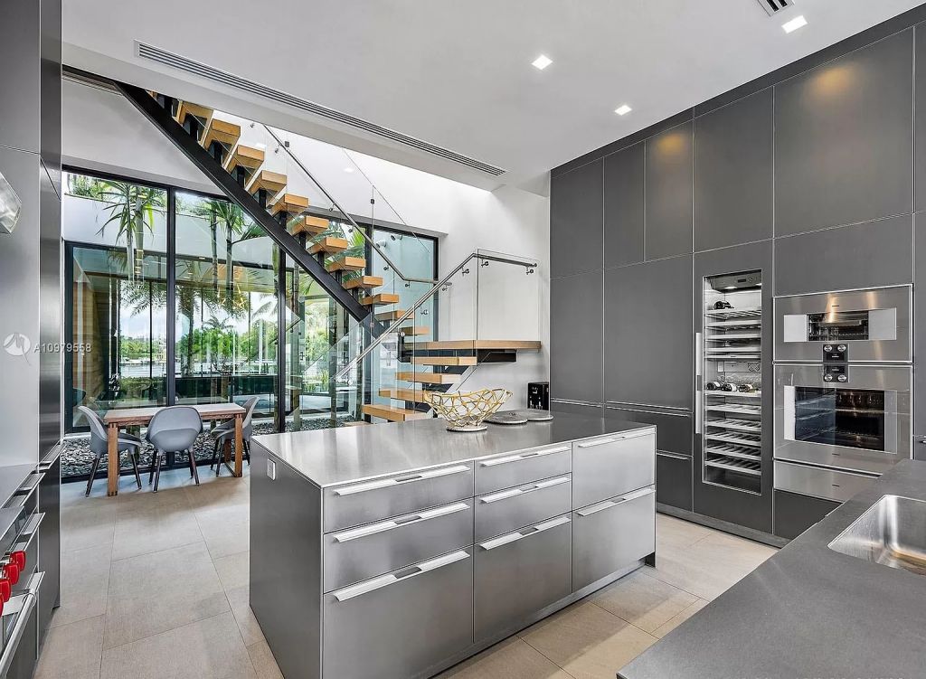 The Boca Raton Mansion is a spectacular contemporary residence on an oversized Intracoastal Waterway lot now available for sale. This home located at 819 Orchid Dr, Boca Raton, Florida; offering 9 bedrooms and 14 bathrooms with over 12,600 square feet of living spaces.